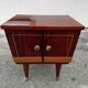 1950s bedside table in varnished wood veneer and brass.