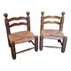 Pair of low fireplace chairs in turned wood and straw, Charles style.