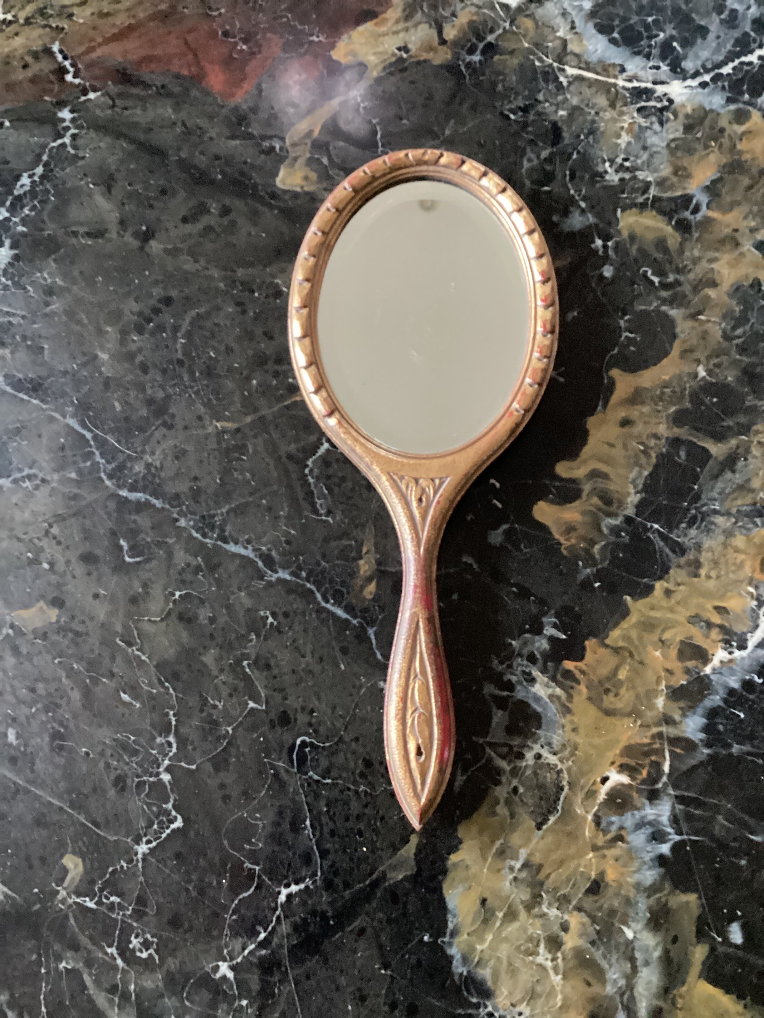 Hand-facing beveled mirror surrounded by wood dimension: height -38cm- width -15.5cm-