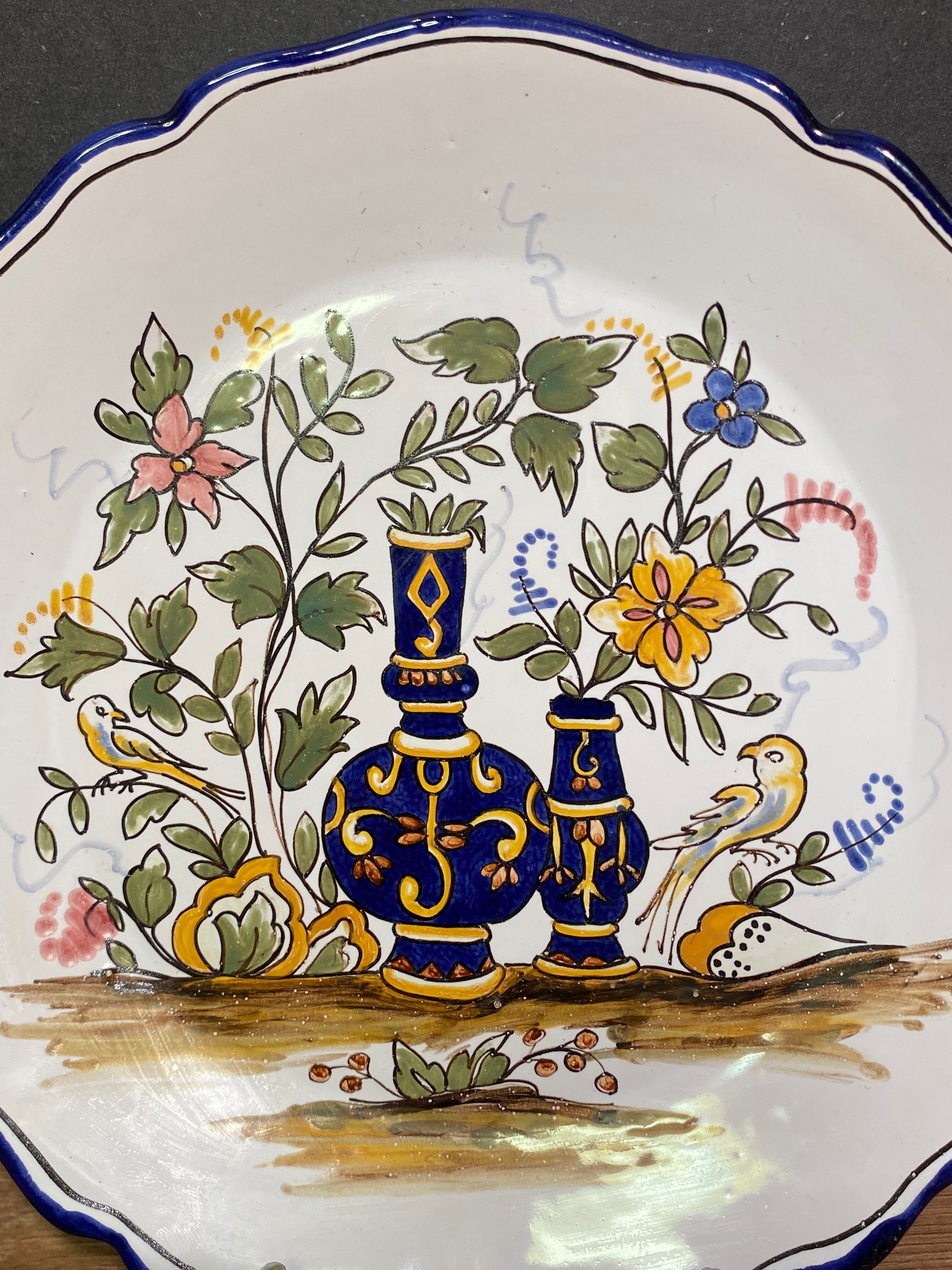 Pair of Nevers earthenware plates signed Georges