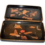 Set of two brown and black Chinese lacquer trays with bird decor
