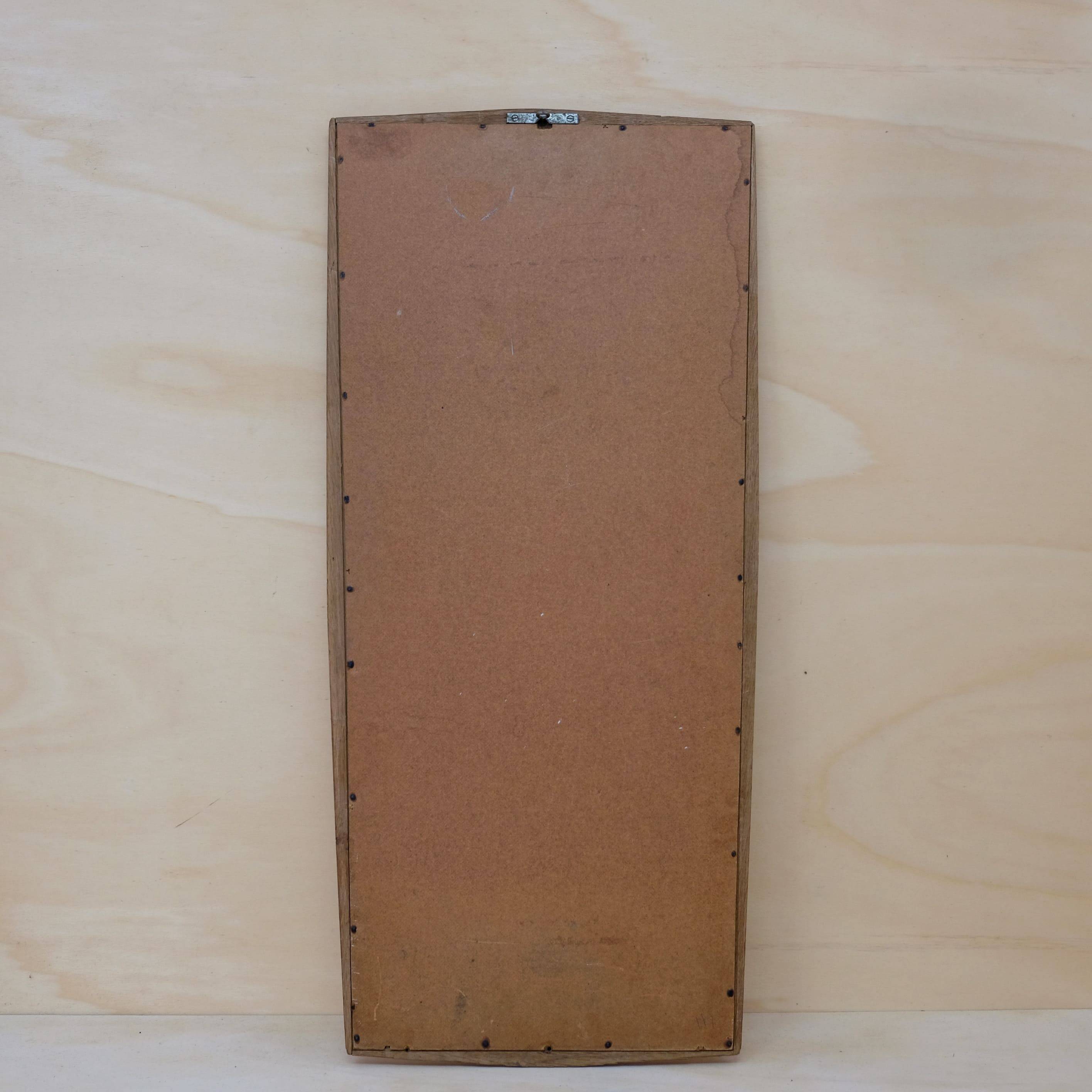 Miroir en chêne des années 60, 84 x 38.5 cm.