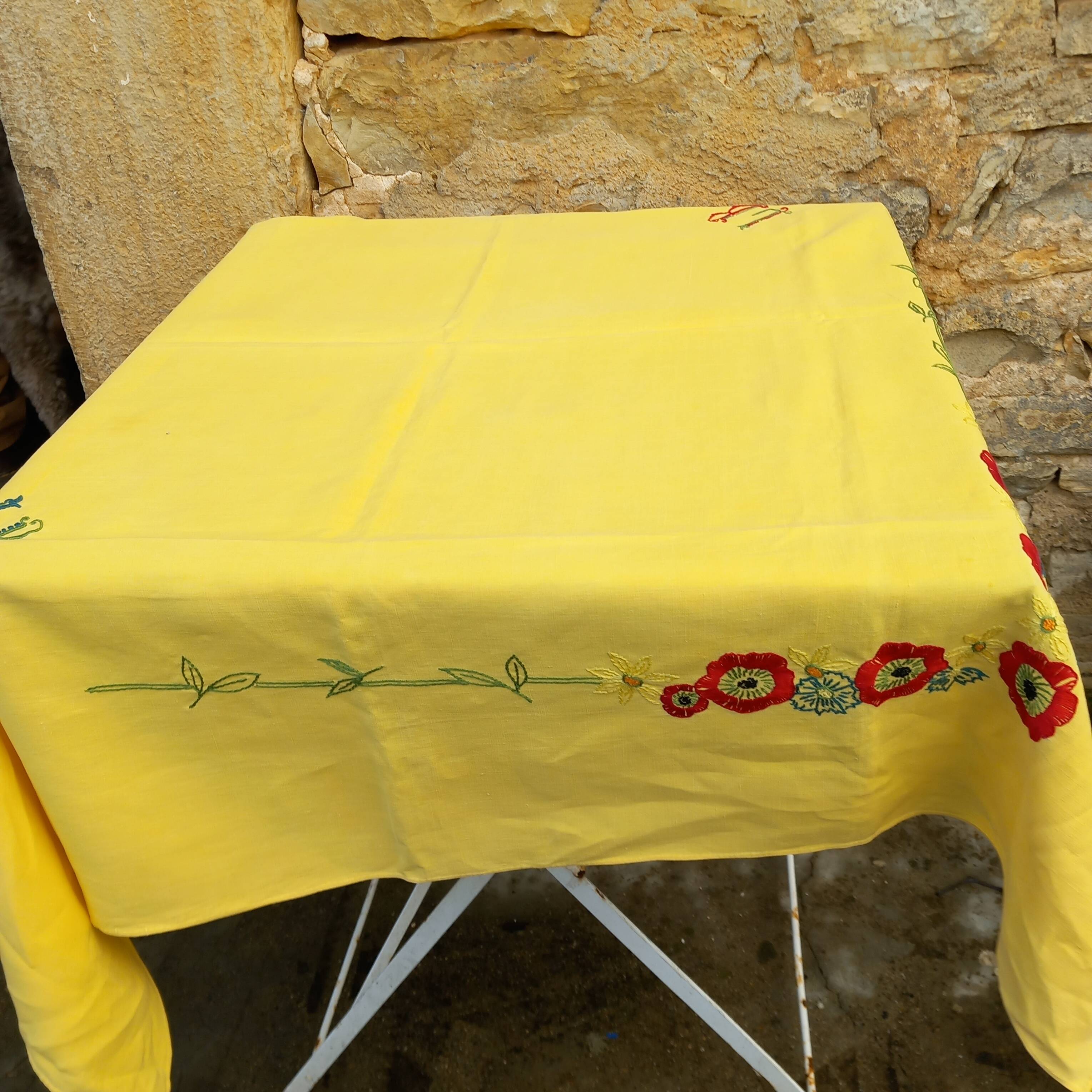 Small vintage yellow embroidered tablecloth and 12 napkins.