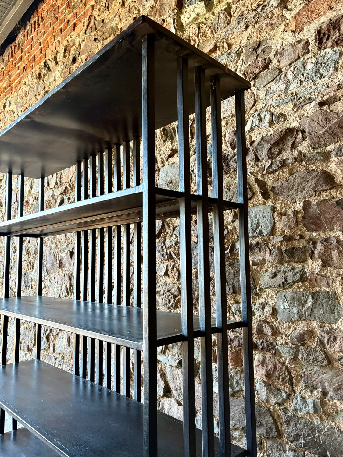 Large industrial black metal shelf – openwork graphic structure