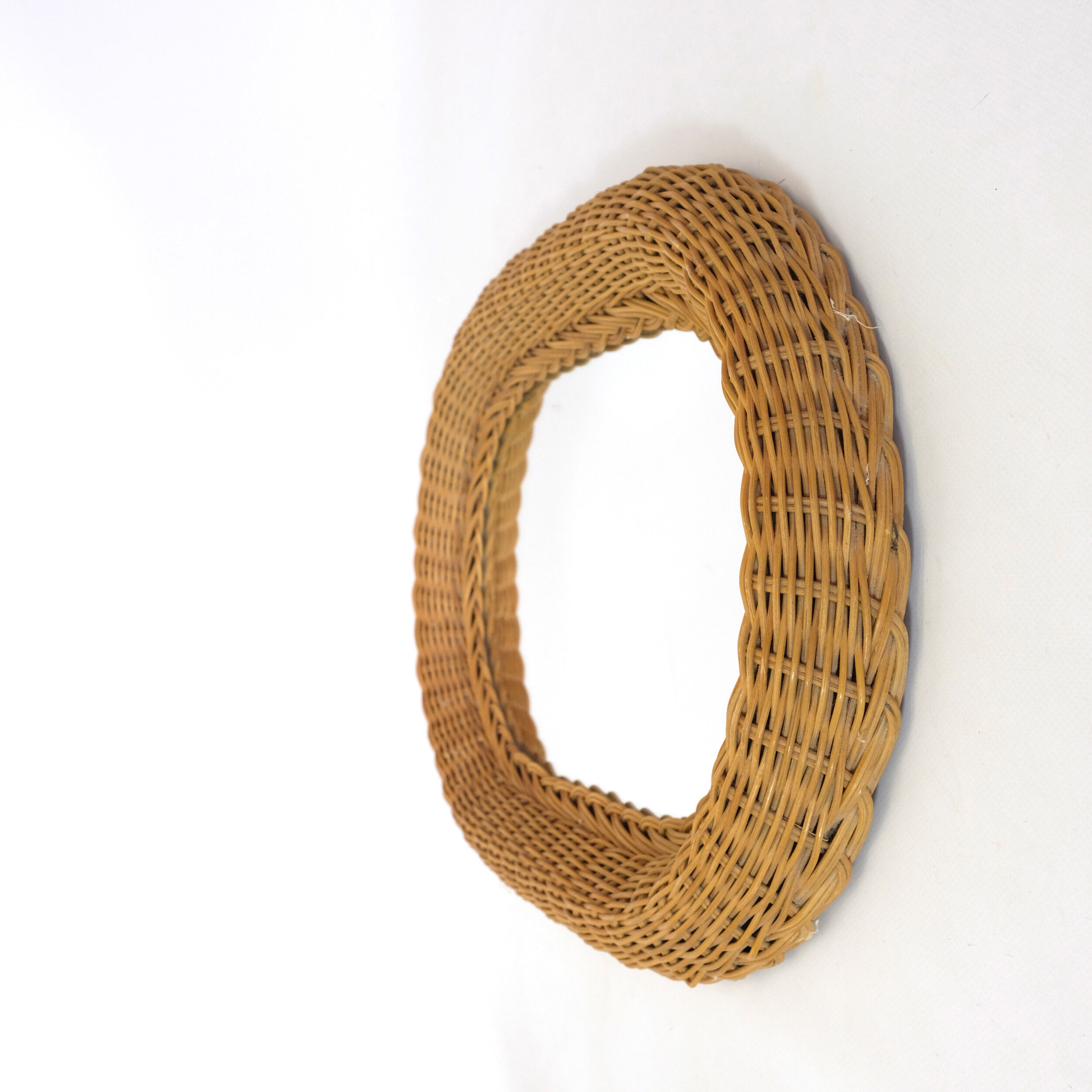 Mirror with thick wicker frame, 54x38 cm.