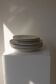 Vintage yellow butter ceramic dinnerware set with swirl border.