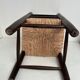 Wooden children's chair with vintage straw seat