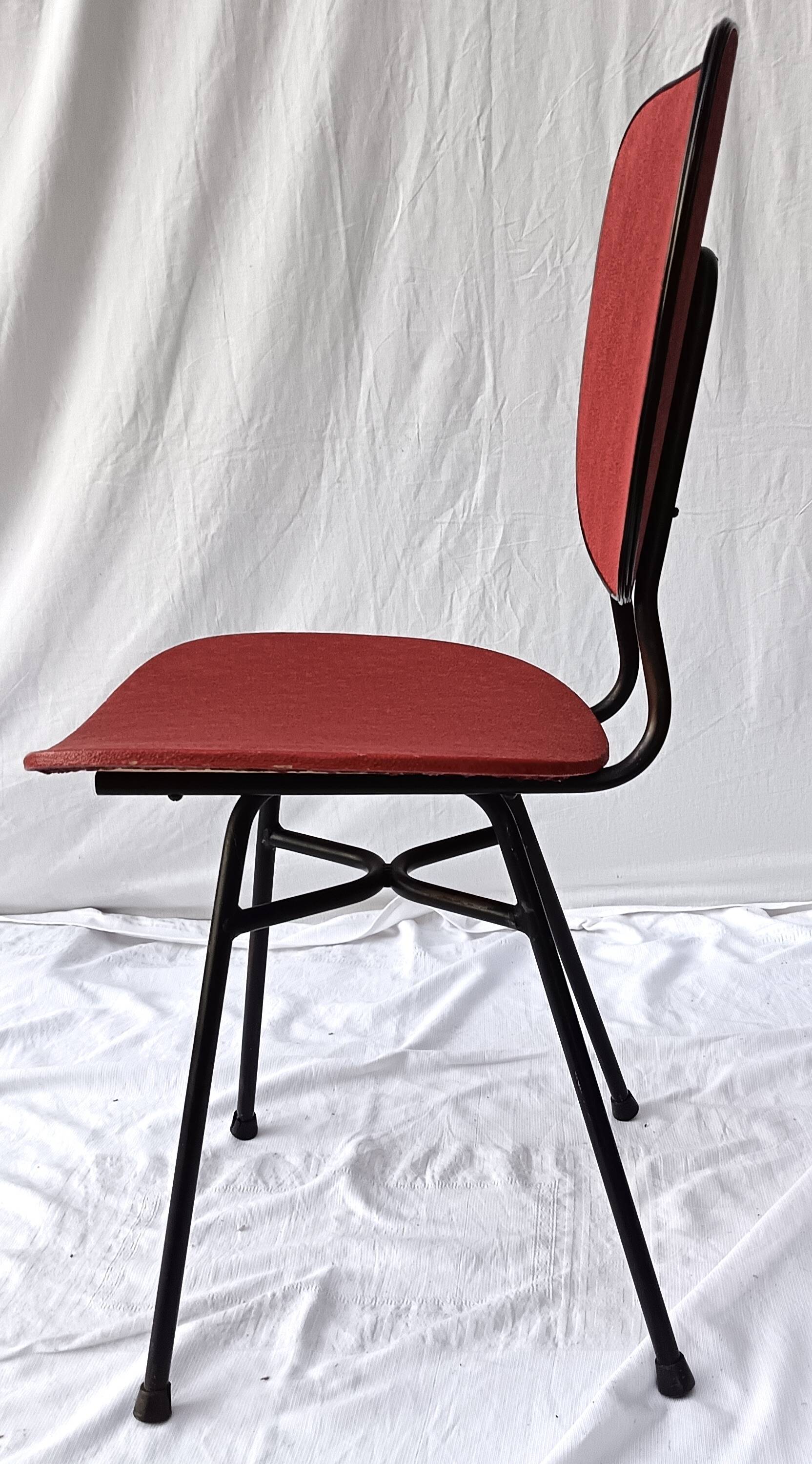 sixties chair with steel tube legs and a skaï seat