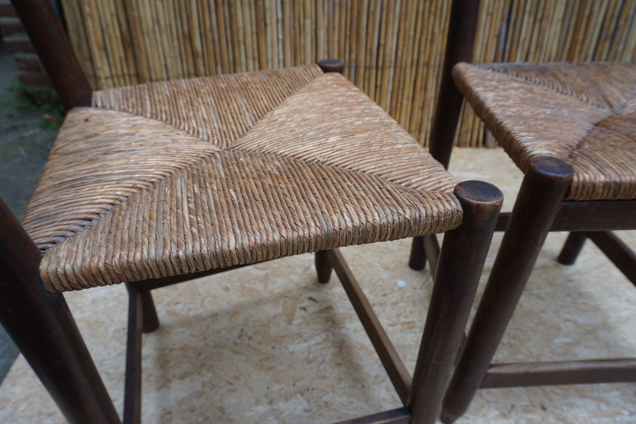 Pair of antique straw-seated farm chairs