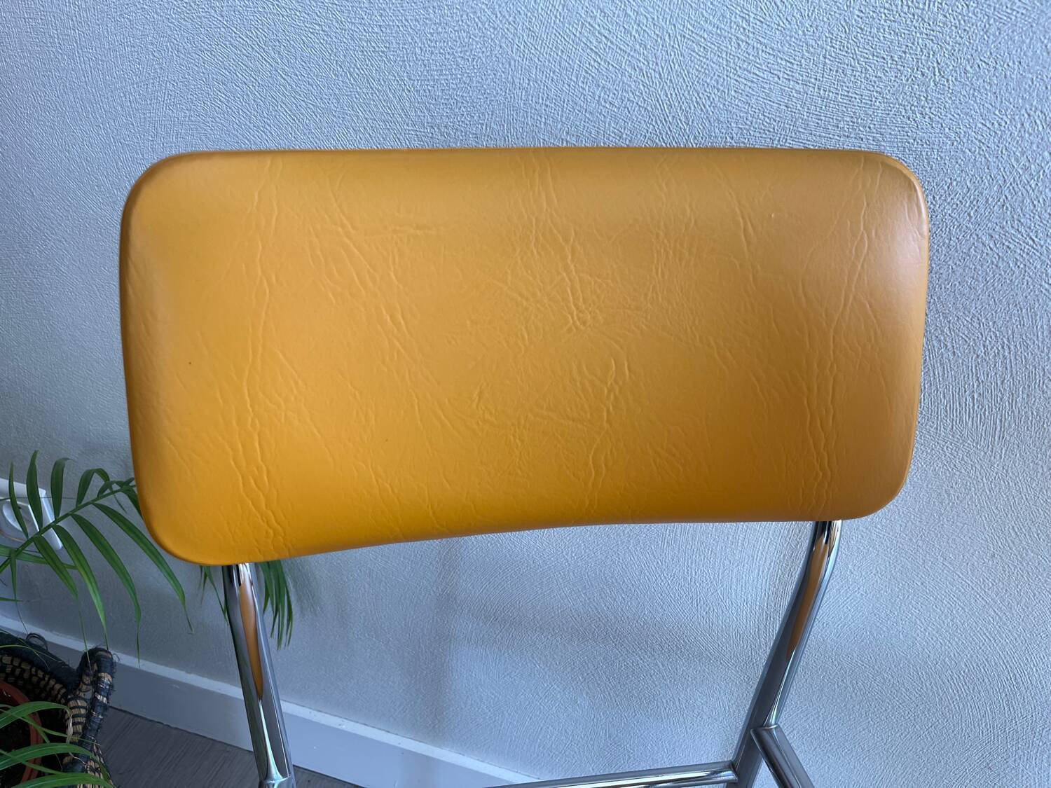 LM vintage chrome and orange/mustard yellow faux leather chairs