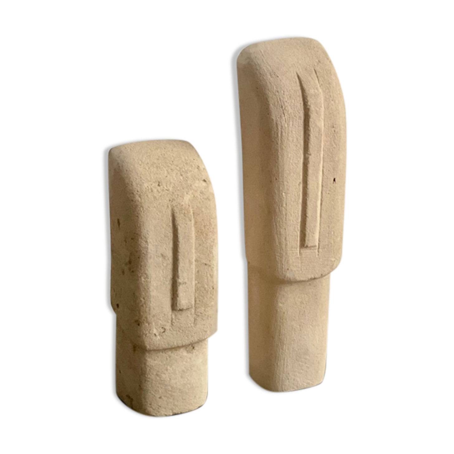 Set of two minimalist stone face statues