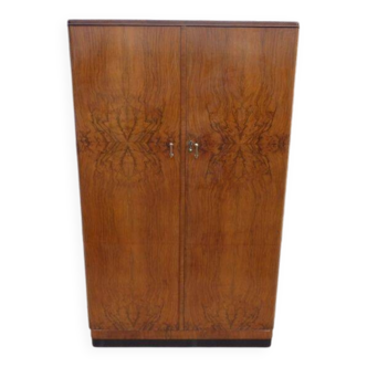 Wardrobe on a plinth in walnut and walnut veneer circa 1940.