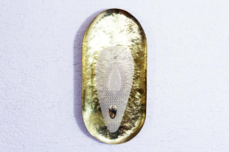 Hammered brass and perforated metal sconce