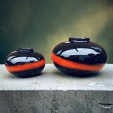 A pair of black and red spherical vases by Bay Keramik, West Germany, from the 1960s.