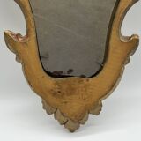Wooden mirror with gilded stucco
