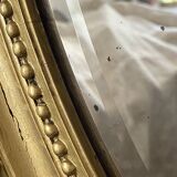 Miroir ancien ovale doré – style Louis XVI avec nœud ruban