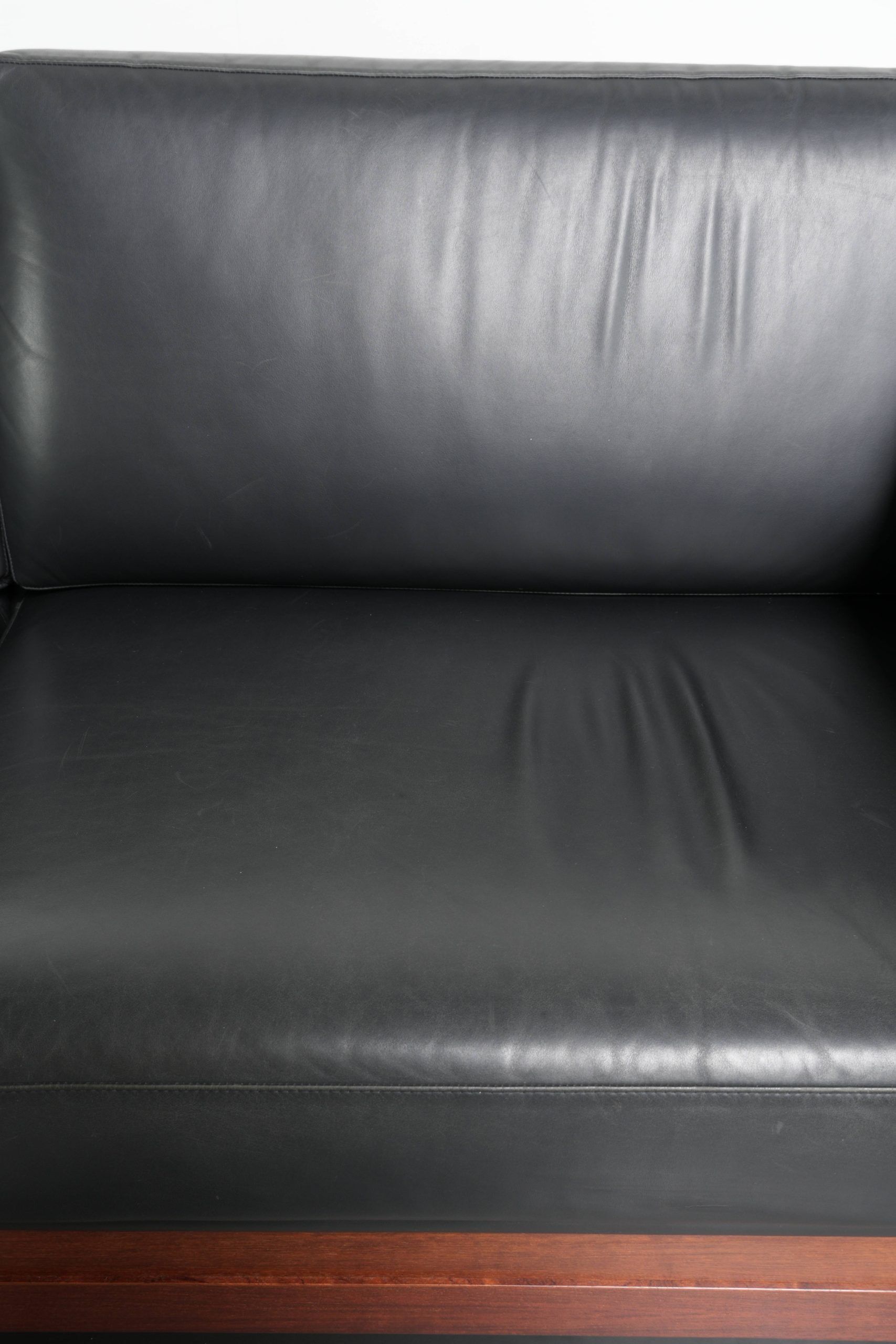 3-seater black cow leather sofa in timeless Art Deco design
