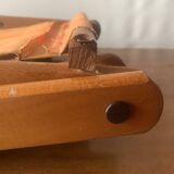 Old foldable beach seat in wood and canvas for children