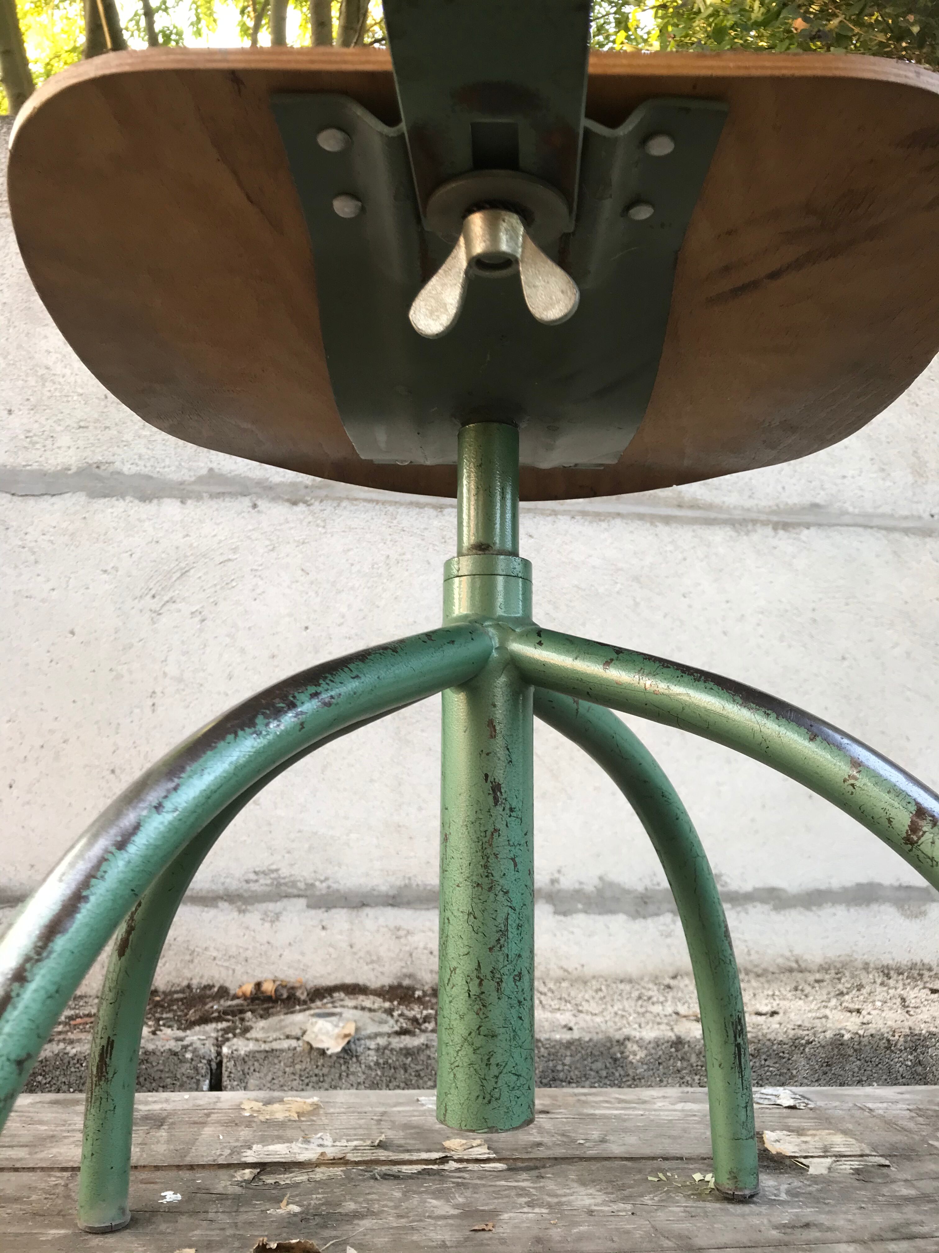 Former green metal workshop chair