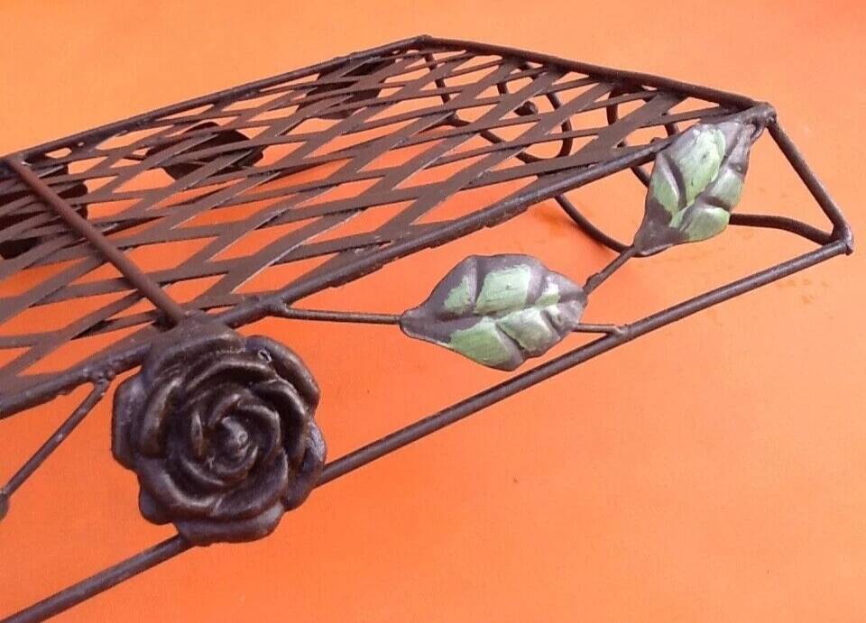 Rectangular metal serving tray with floral decoration.