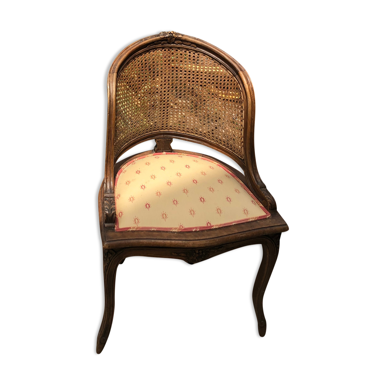 Old wooden armchair and cannage