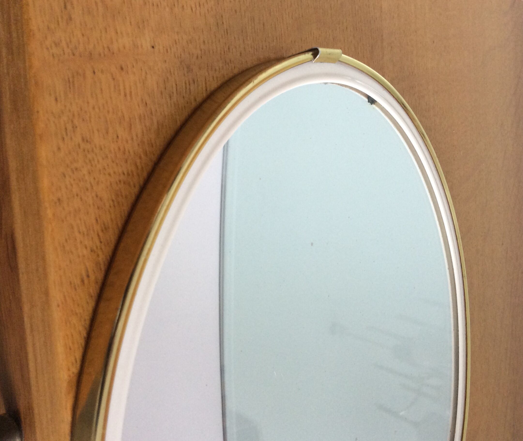 Free-form oval sheathed mirror from the 60s and 70s