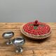 A trompe l’oeil strawberry pie dish