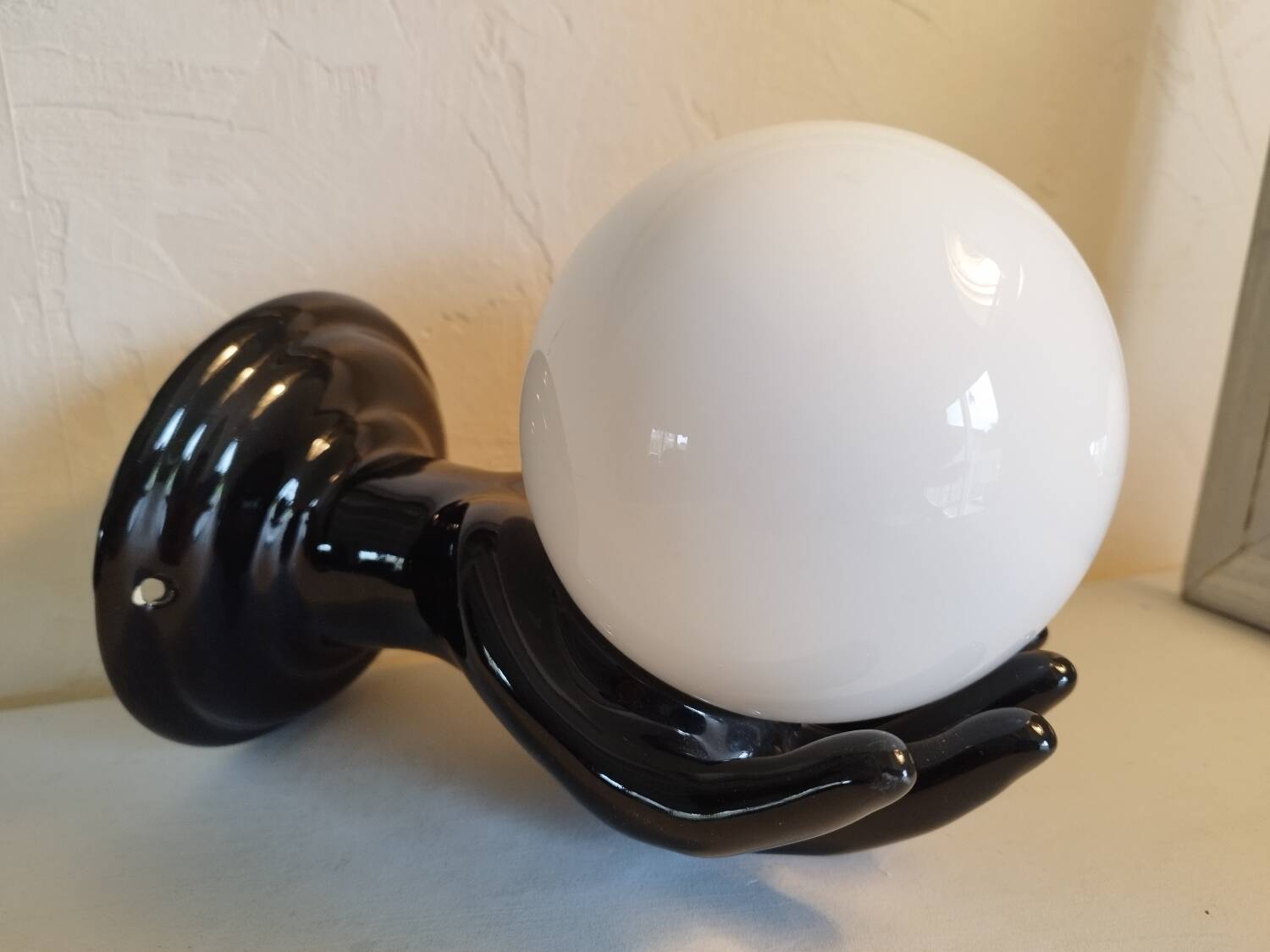 Hand-shaped wall light