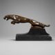 Large Art Deco bronze patinated Jaguar sculpture on an architectural base.