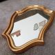 Vintage baroque mirror in gilded wood in the Louis XV style.