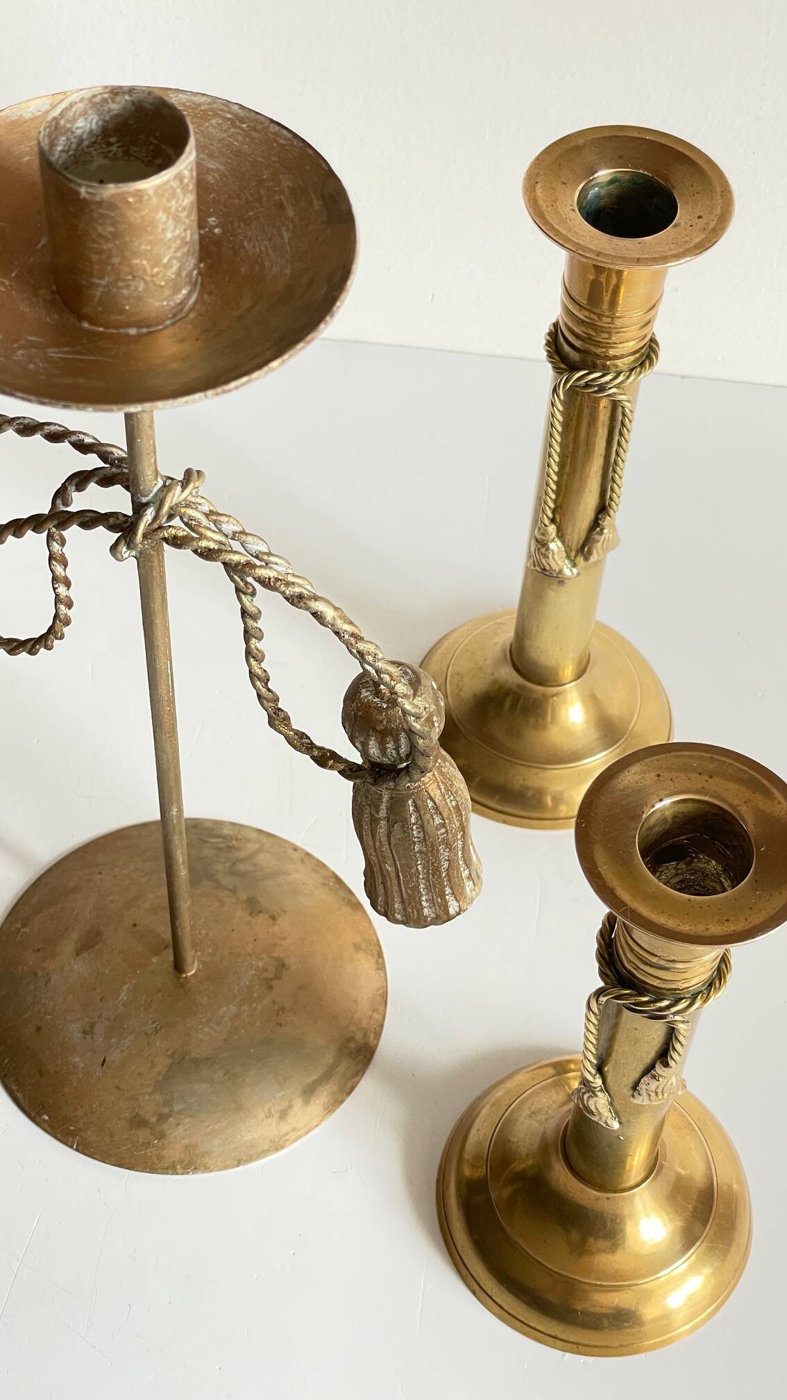 Trio of vintage knotted candlesticks brass