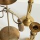 Trio of vintage knotted candlesticks brass