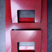 Vintage red metal wall magazine rack
