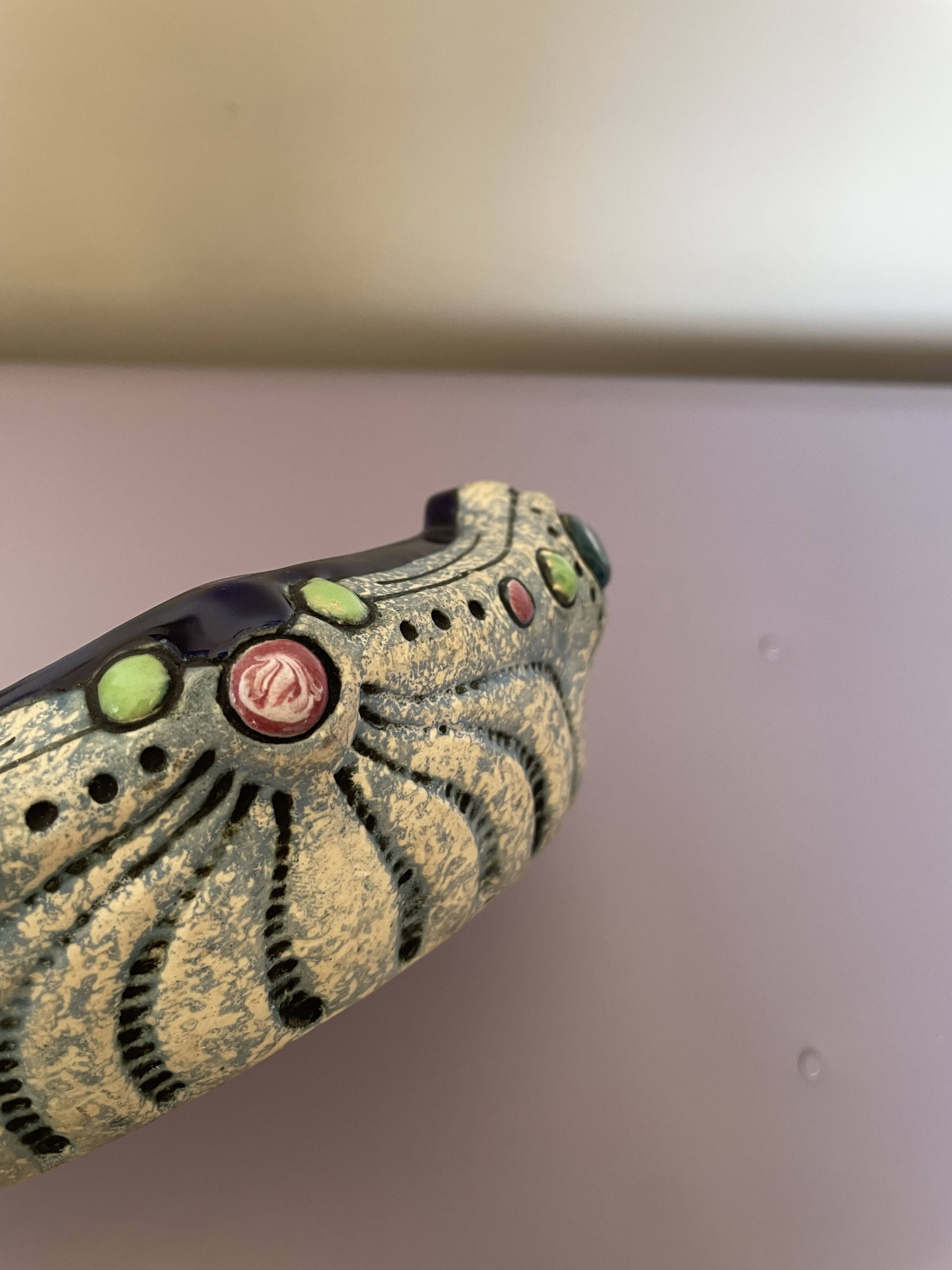 Art Nouveau pocket emptier