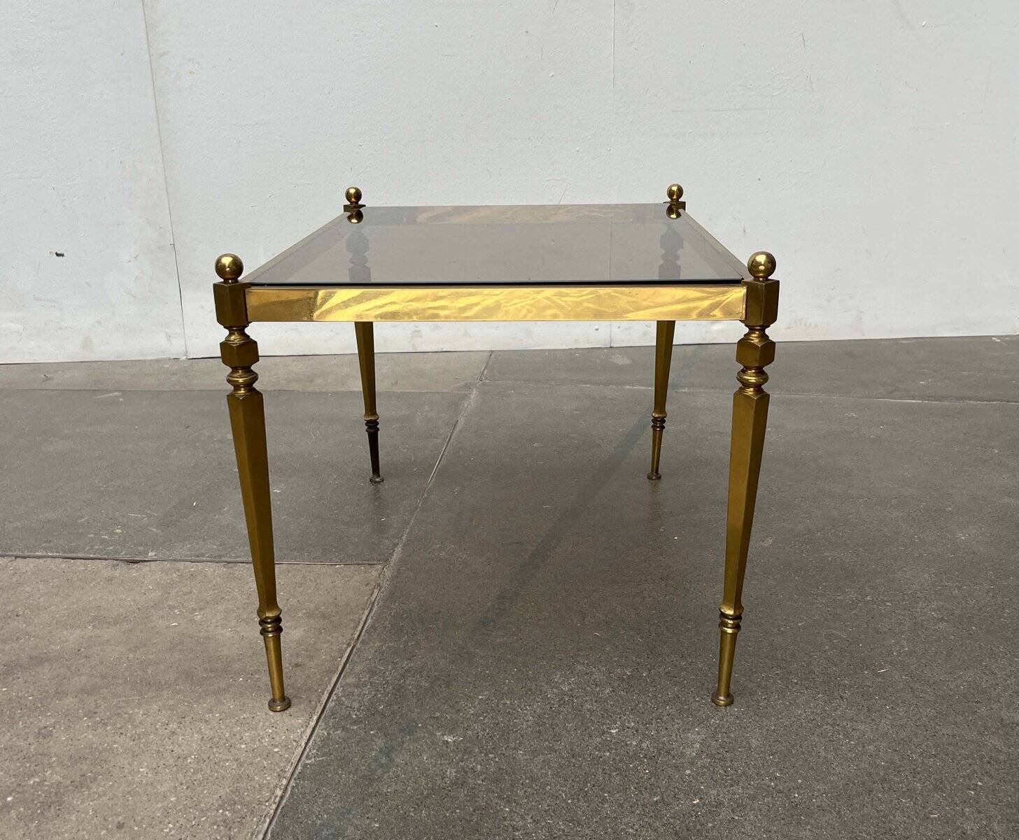 Mid-century German Hollywood neoclassical brass and glass side table from the 1950s.