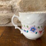 Porcelain cup with chiseled and gilded rim