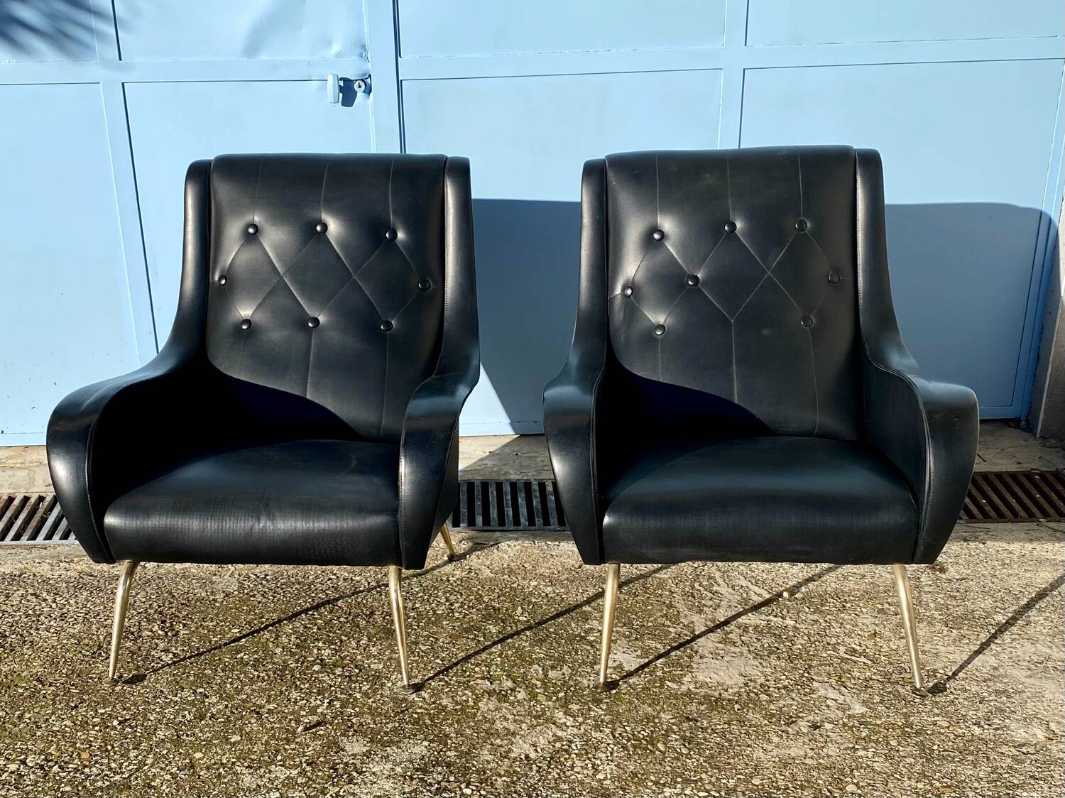 2 vintage faux leather armchairs