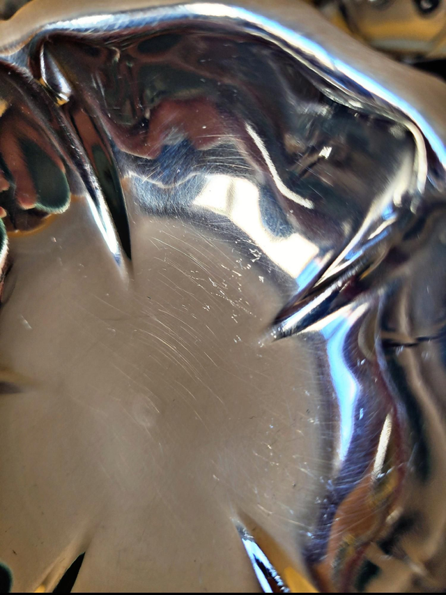 Stainless steel ice bowls by Guy Degrenne, low bowls in the shape of a flower.