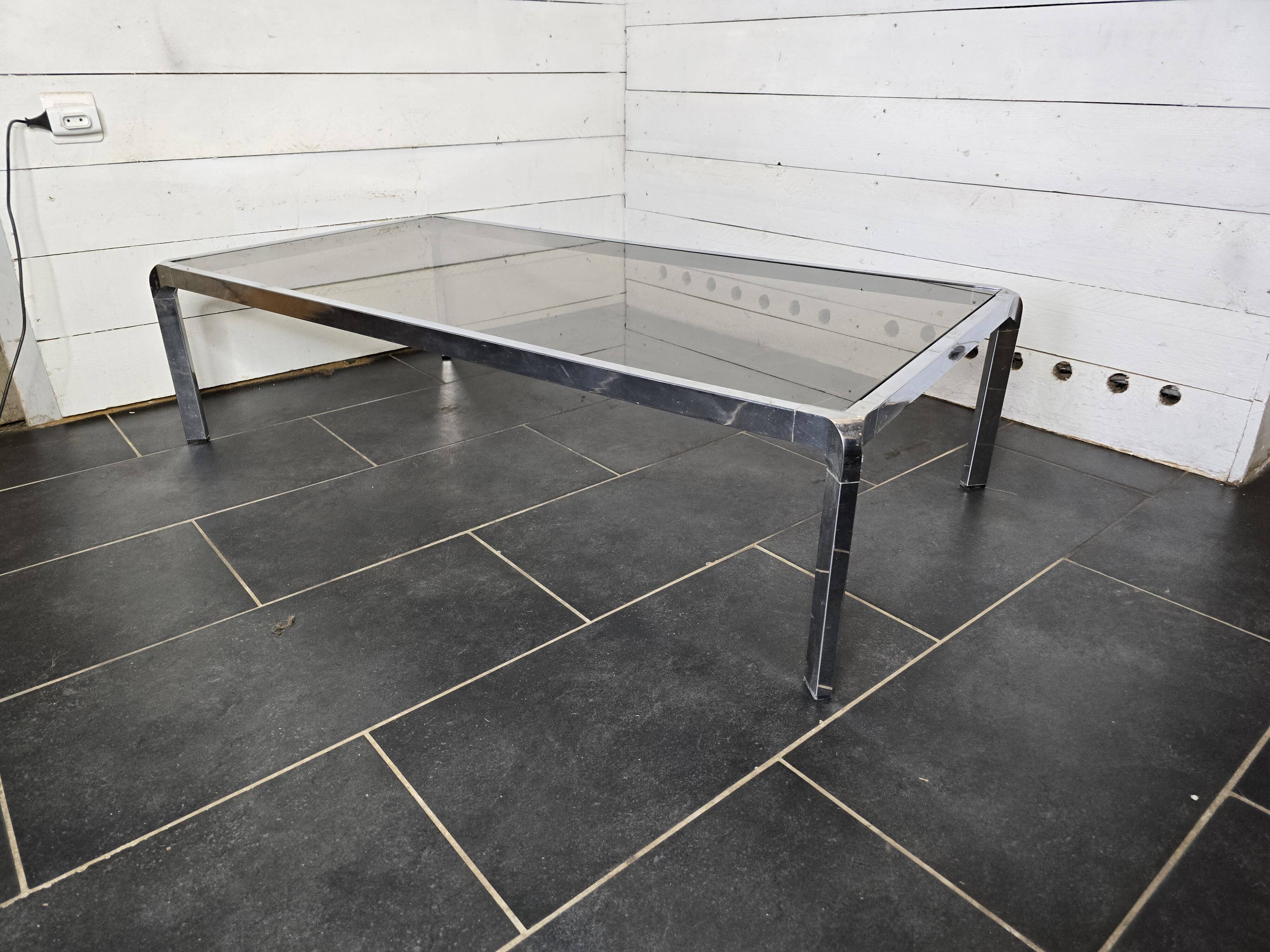 Chromed metal coffee table with smoked glass top from the 70s