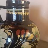 Large glazed terracotta pitcher with floral decoration