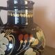 Large glazed terracotta pitcher with floral decoration