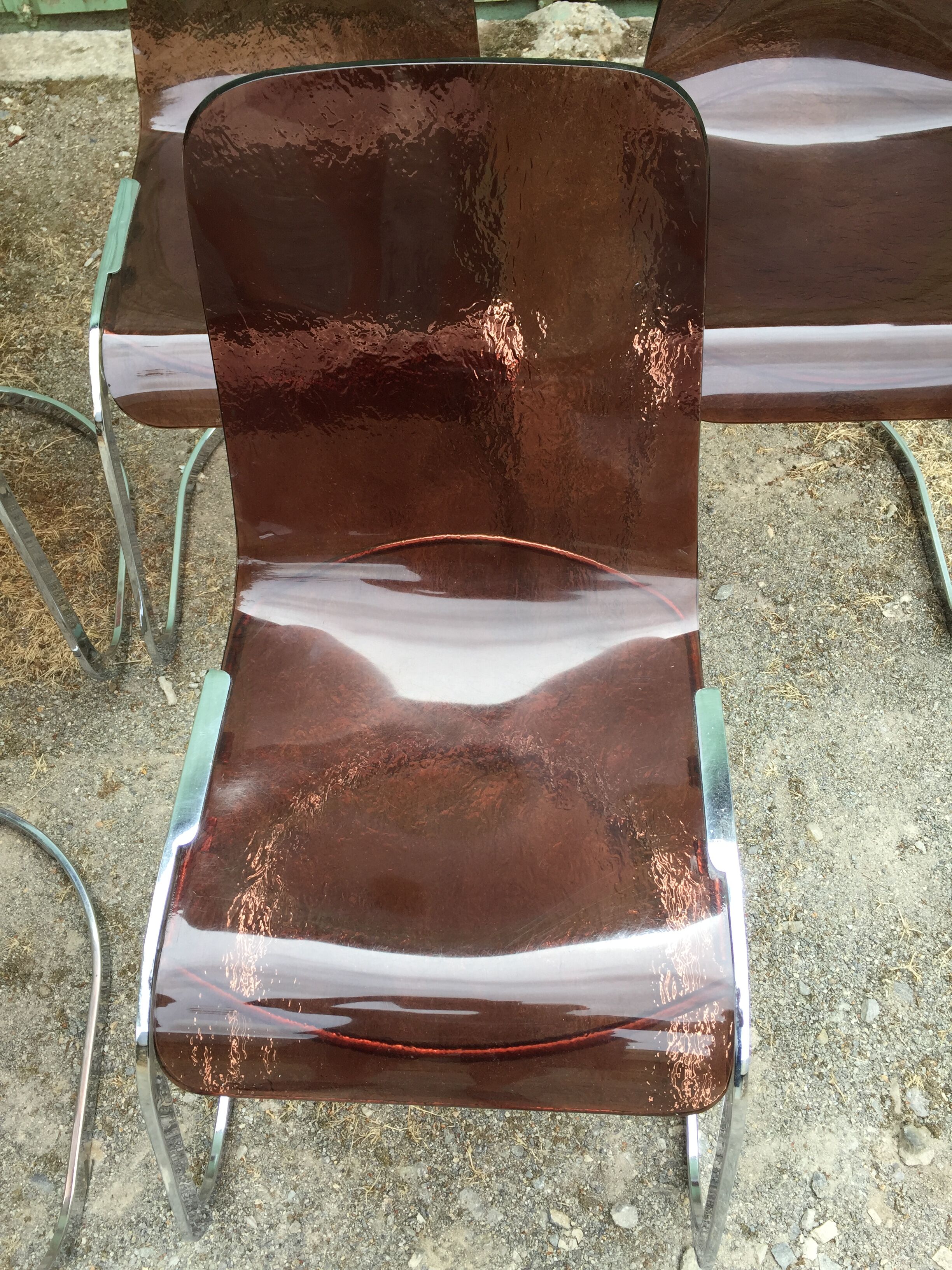 Chairs in plexiglas with chrome metal base