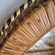 Woven rattan and wicker shelf mirror in the Emmanuelle style, Spain, 1970s.