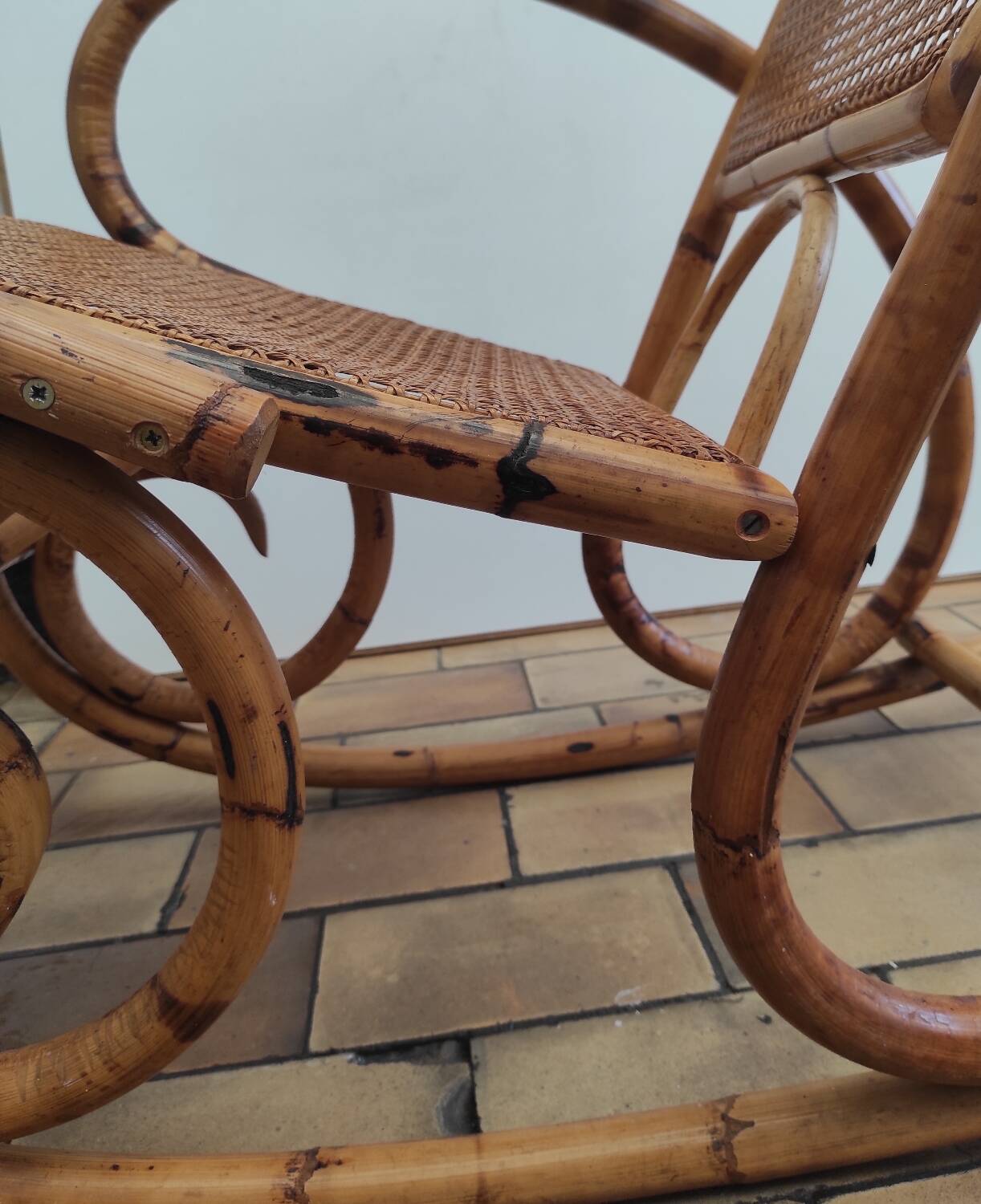 Vintage rocking chair in rattan and cane.