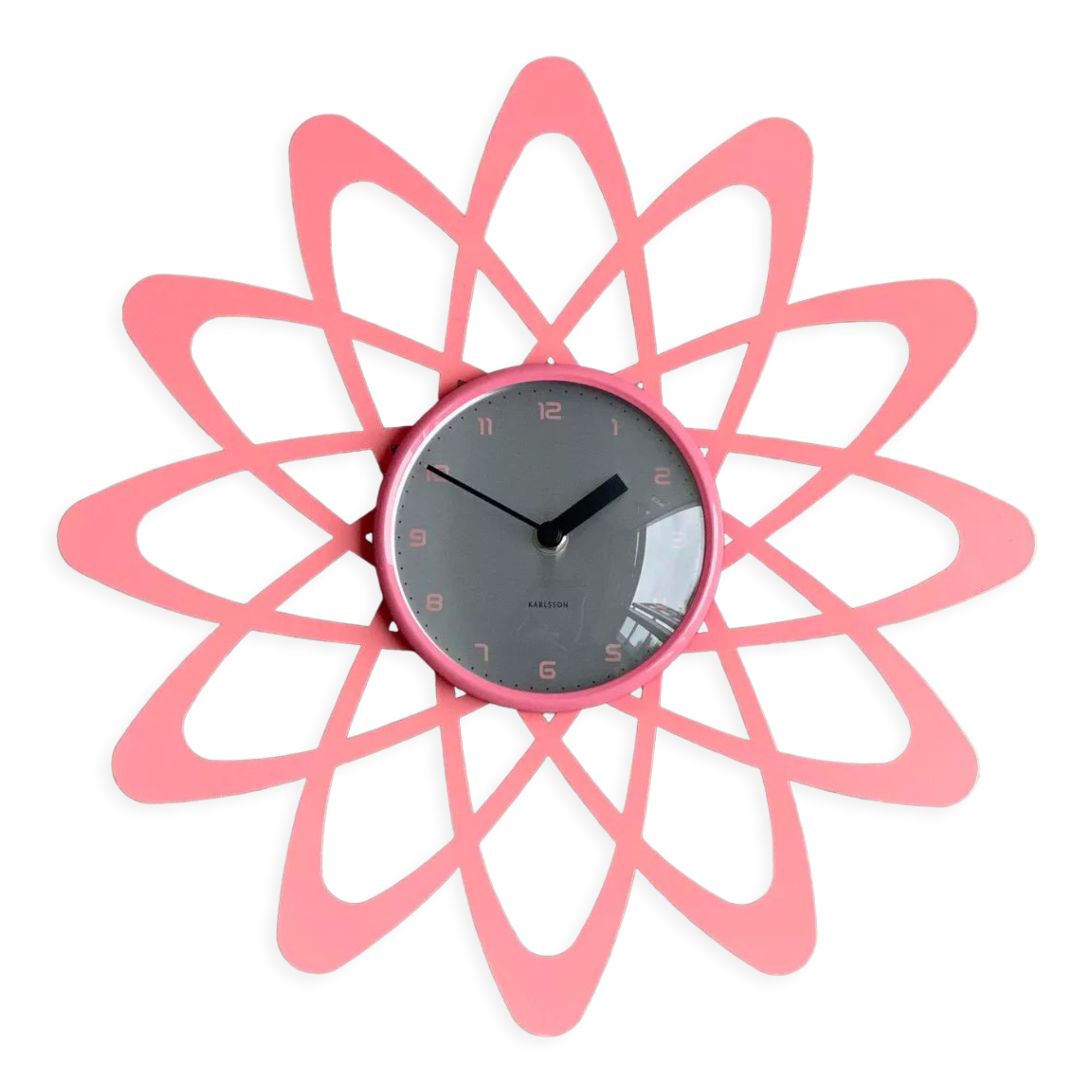 Pink Karlsson wall clock in a mid century shape
