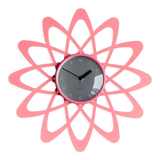 Pink Karlsson wall clock in a mid century shape