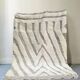 Large hand-knotted beige and cream Berber rug, 2.90m x 1.80m.