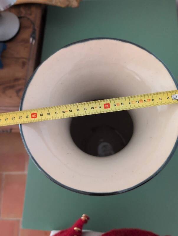 Large vintage antique vase with raised floral pattern.