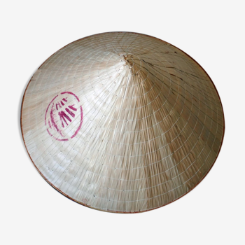 Conical hat brought back from Thailand in bamboo covered with palm leaves
