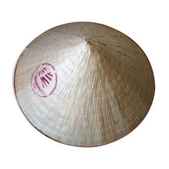 Conical hat brought back from Thailand in bamboo covered with palm leaves